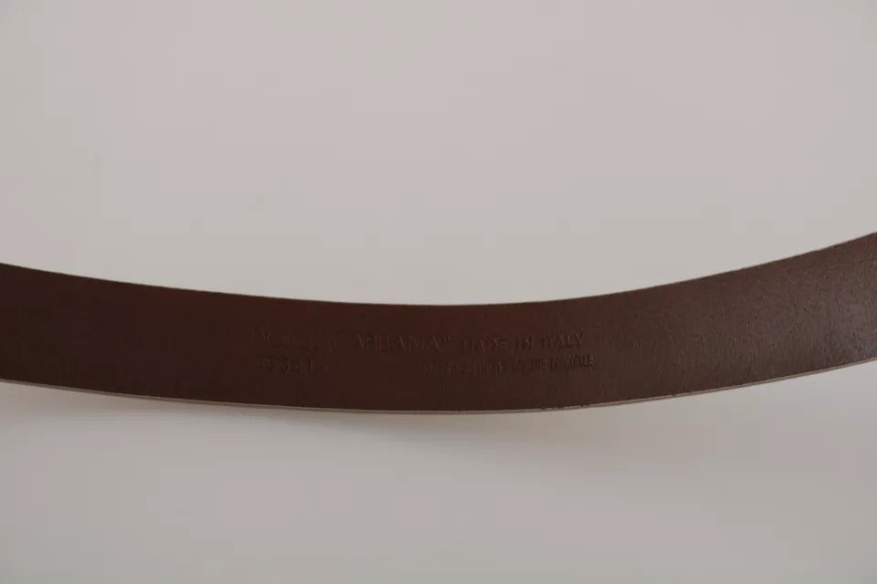 Cream beige leather belt with gold buckle from Dolce & Gabbana, featuring a sleek waist design and elegant stitching.