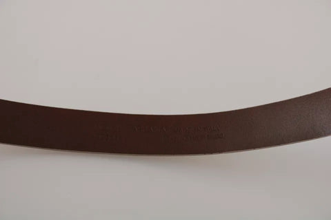 Cream beige leather belt with gold buckle from Dolce & Gabbana, featuring a sleek waist design and elegant stitching.