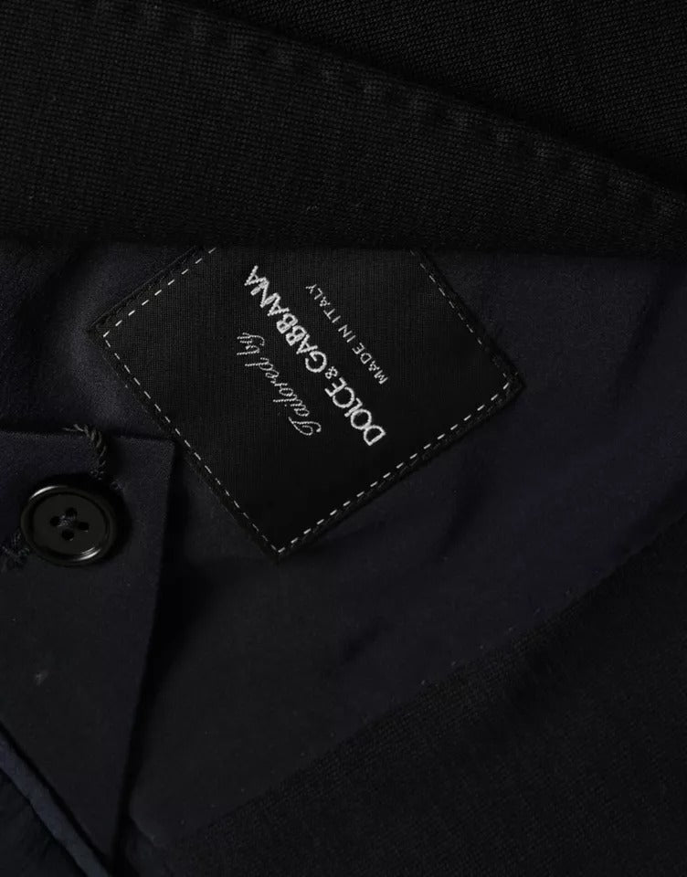 Blue wool notch single-breasted coat blazer by Dolce & Gabbana, shown on a hanger with front view and tailored details.