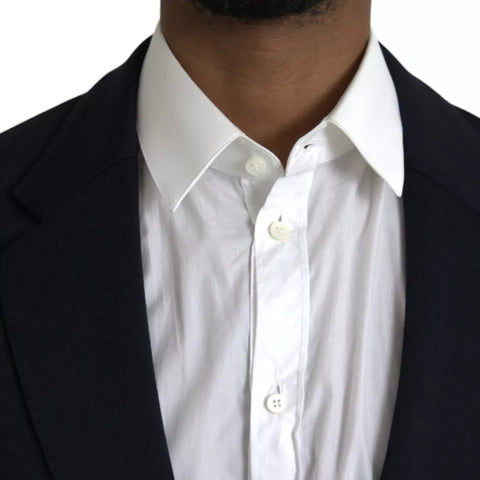 Blue wool single-breasted coat blazer with notch lapels by Dolce & Gabbana, shown on a model.