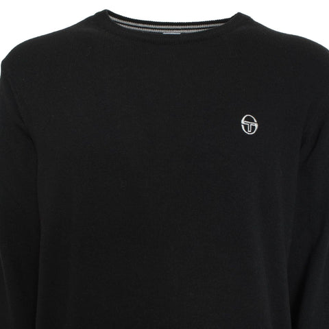 Black Sergio Tacchini sports jacket with logo, displayed on a hanger against a neutral background.