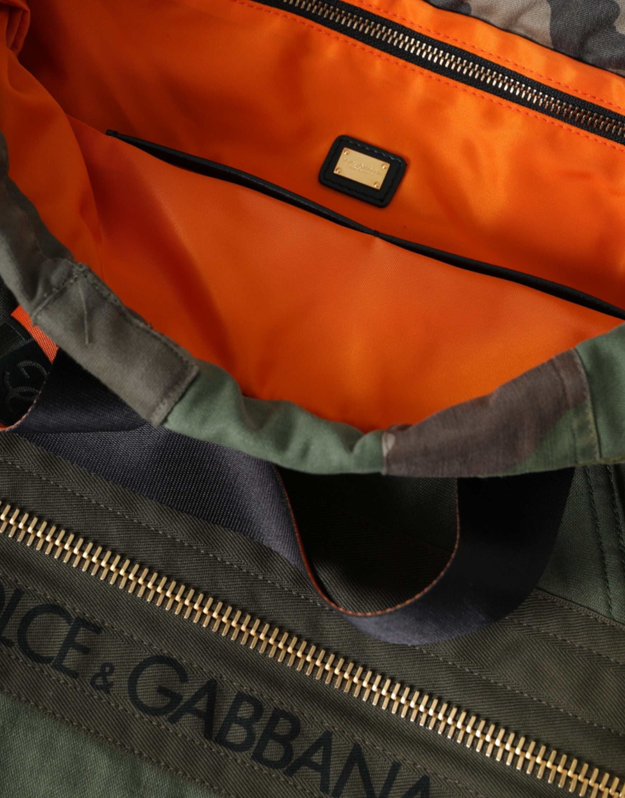 Military green patchwork rucksack backpack by Dolce & Gabbana with adjustable straps and multiple compartments.