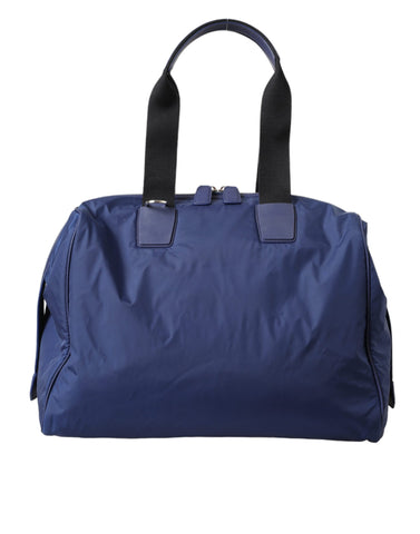 Blue nylon and calfskin Dolce & Gabbana hand shoulder duffel bag with top handles and shoulder strap.
