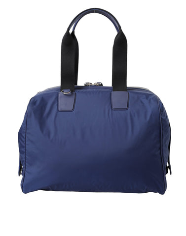 Blue nylon and calfskin Dolce & Gabbana hand shoulder duffel bag with top handles and adjustable shoulder strap.