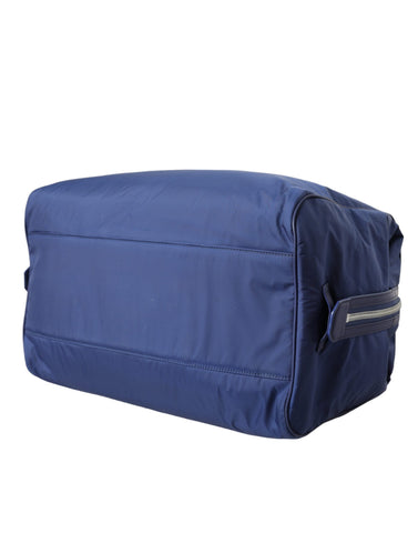 Blue nylon and calfskin Dolce & Gabbana hand shoulder duffel bag with sturdy handles and spacious interior.