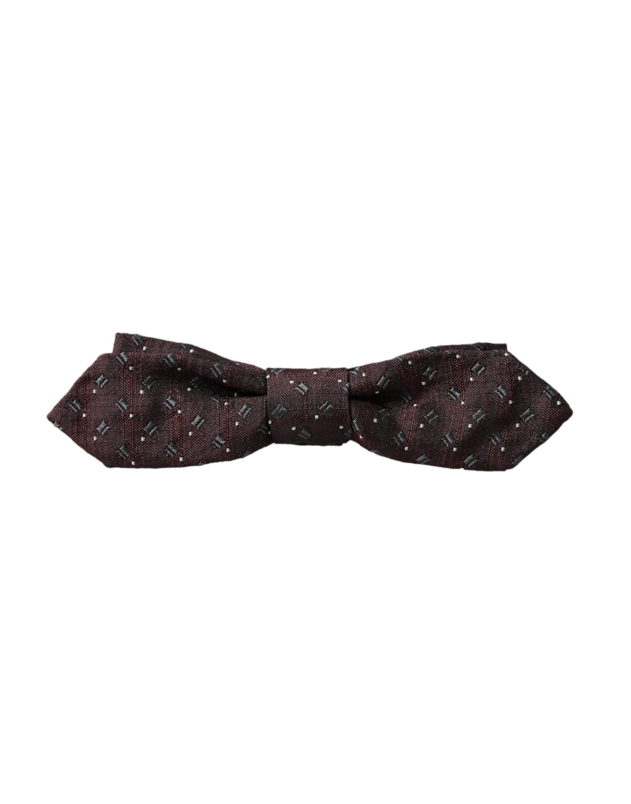 Maroon silk patterned adjustable neck bow tie by Dolce & Gabbana, featuring a stylish papillon design and classic bow shape.