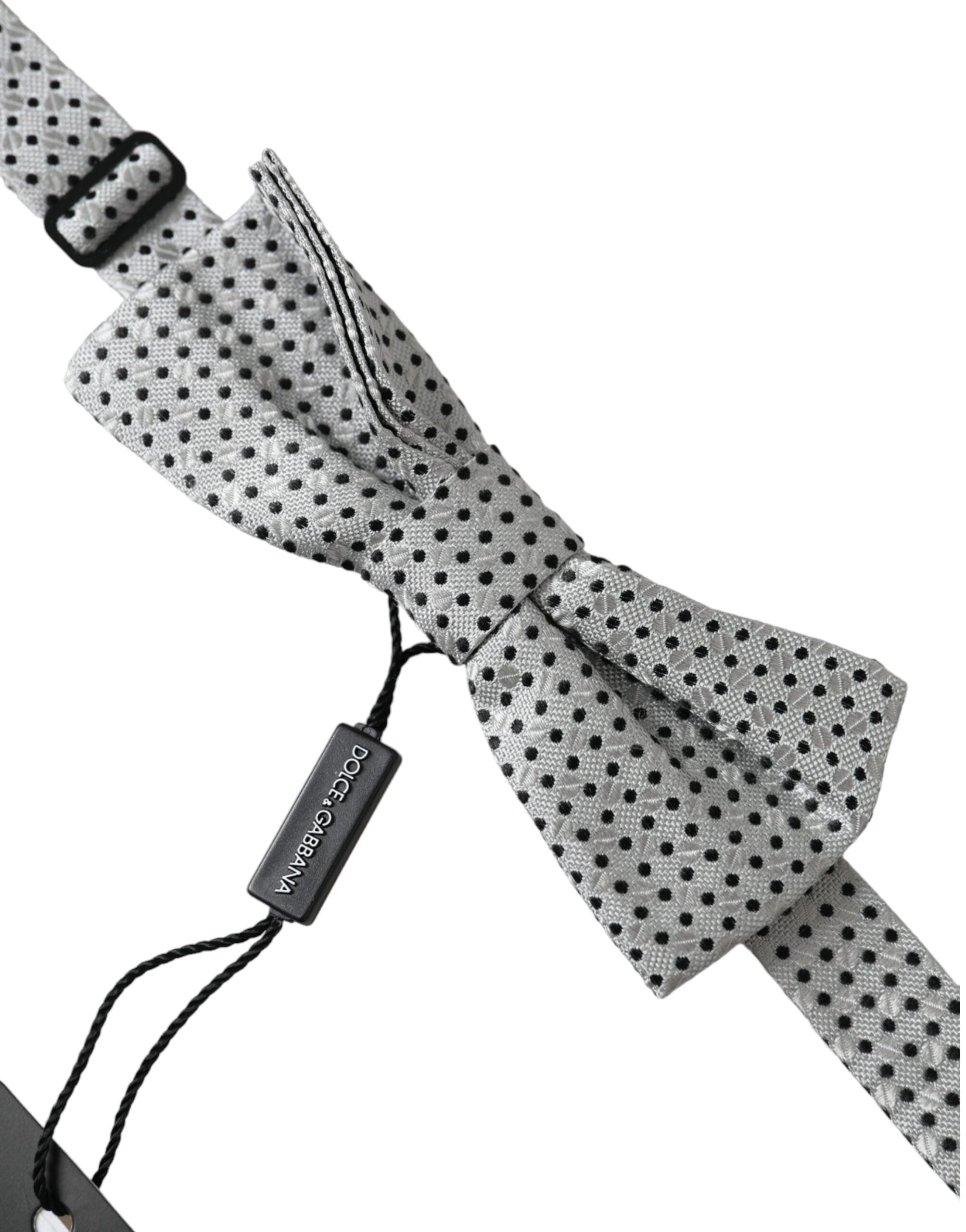 Gray silk polka dot adjustable men's bow tie with papillon style by Dolce & Gabbana, featuring classic polka dot pattern and elegant design.