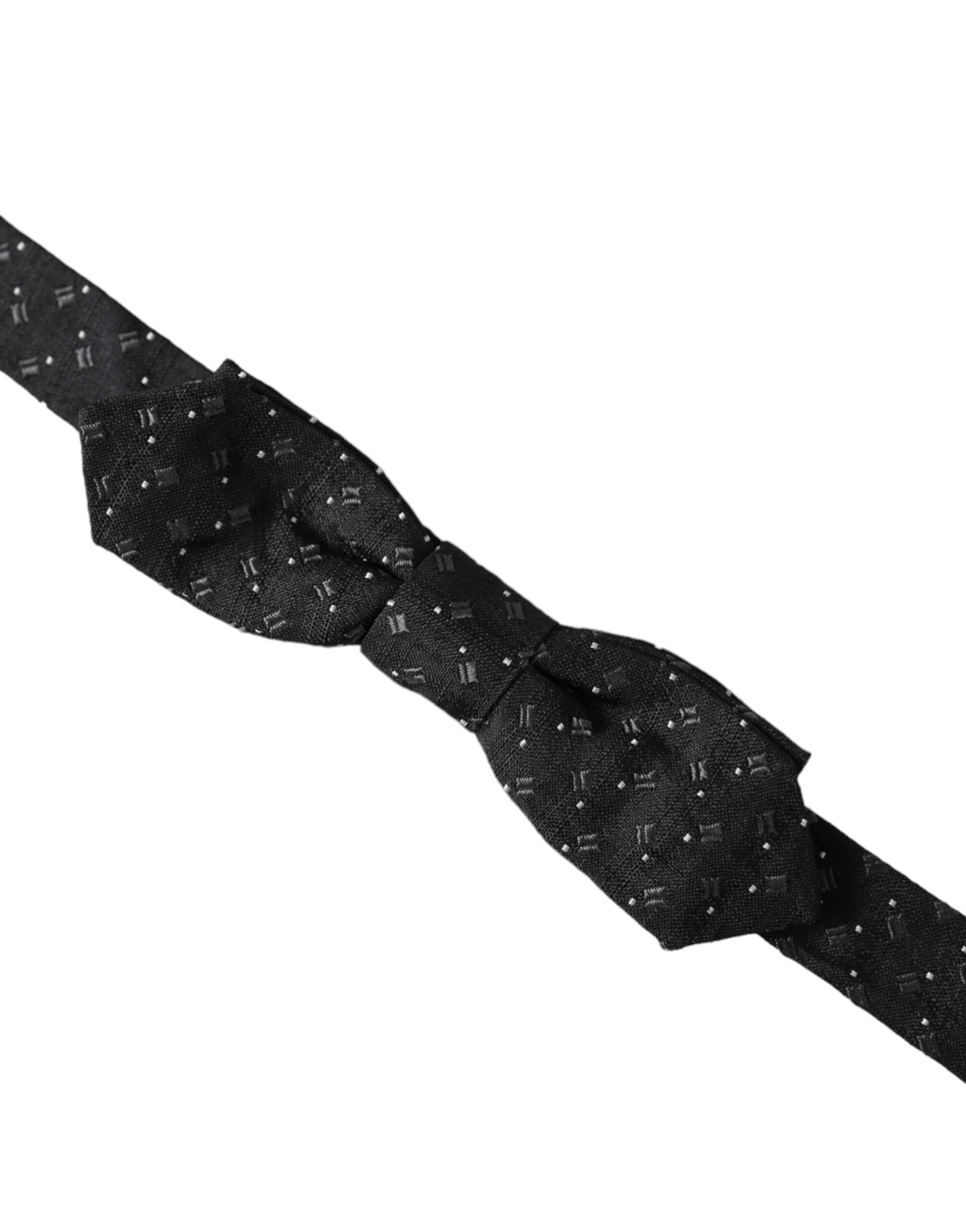 Black silk patterned adjustable neck bow tie for men by Dolce & Gabbana, featuring a stylish papillon design.