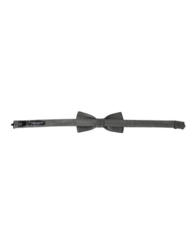 Gray silk patterned adjustable men's bow tie with papillon style by Dolce & Gabbana, featuring elegant design and classic knot.