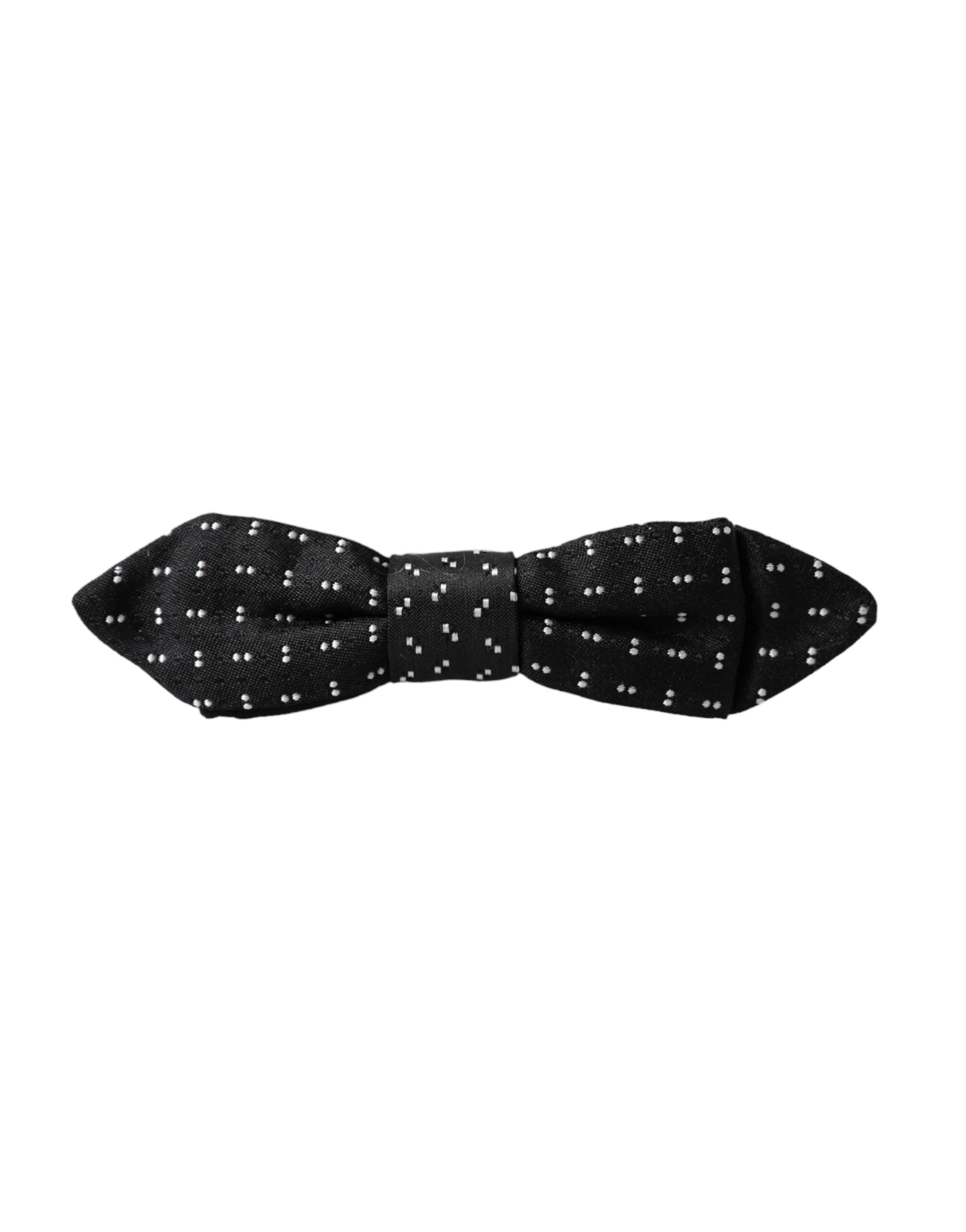 Black silk patterned adjustable men's bow tie with papillon style from Dolce & Gabbana, featuring elegant design and classic shape.