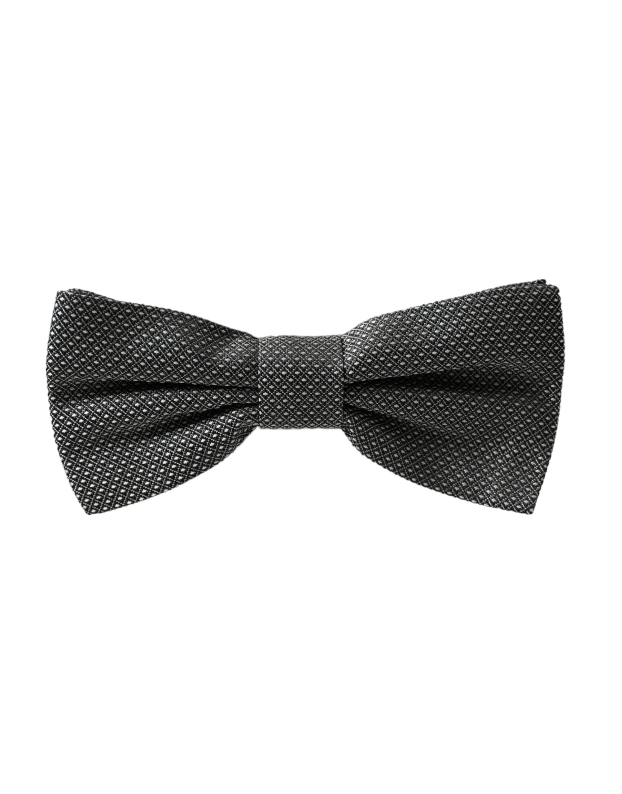 Gray silk patterned adjustable men's bow tie by Dolce & Gabbana, shown with detailed fabric design and classic knot style.