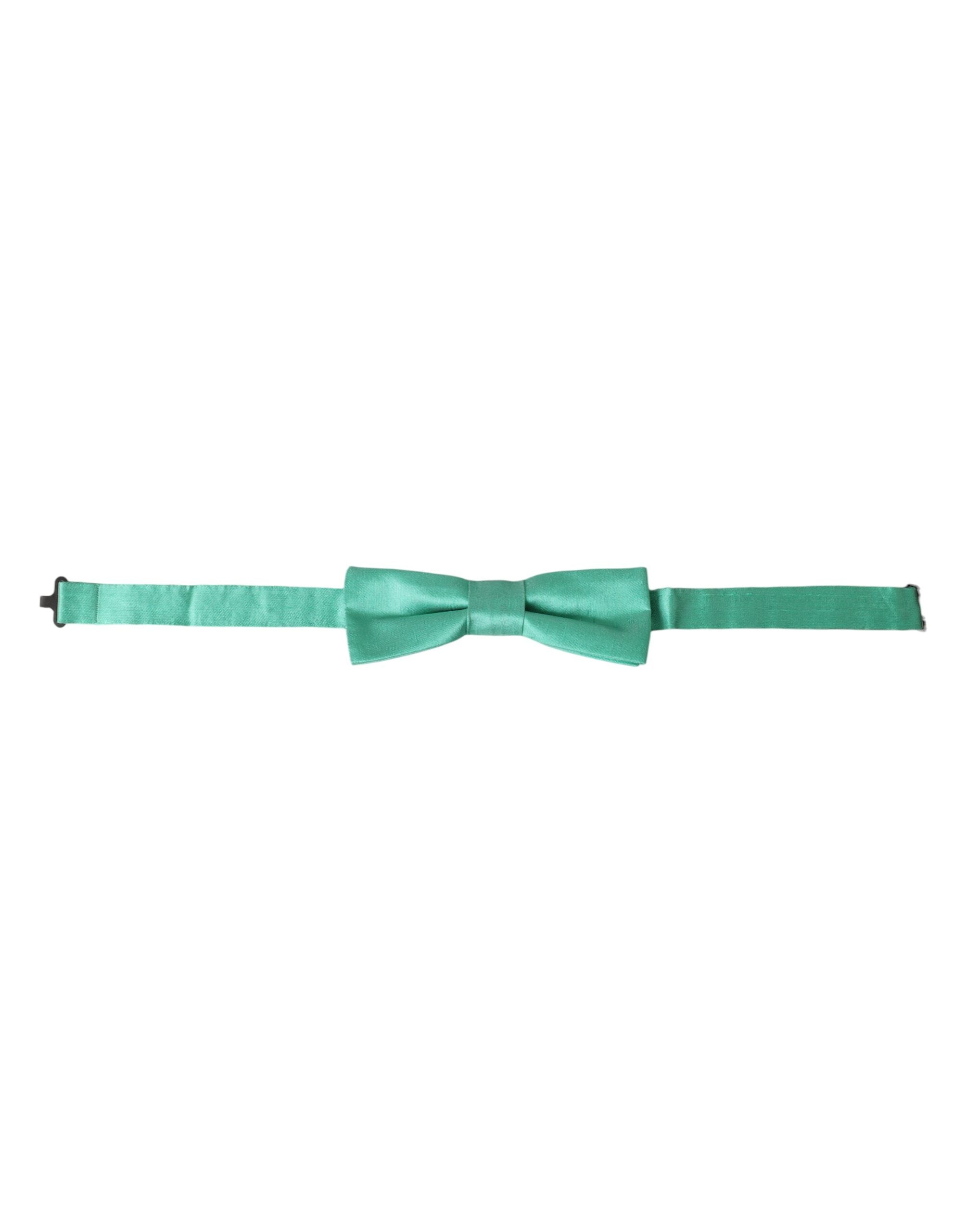 Mint green silk adjustable neck bow tie for men by Dolce & Gabbana, shown on a white background.