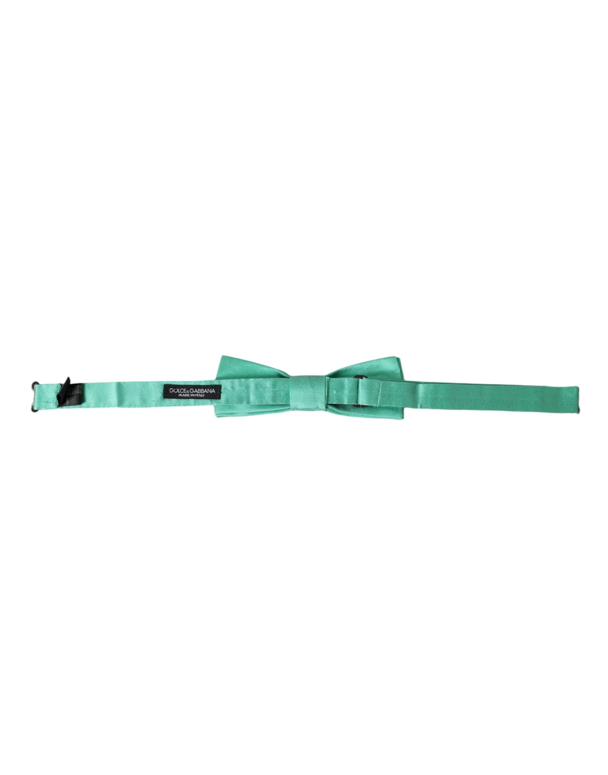 Mint green silk men's bow tie with adjustable neck strap from Dolce & Gabbana, featuring elegant, smooth fabric and classic style.