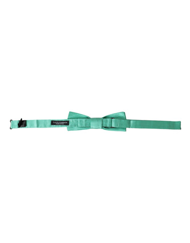 Mint green silk men's bow tie with adjustable neck strap from Dolce & Gabbana, featuring elegant, smooth fabric and classic style.