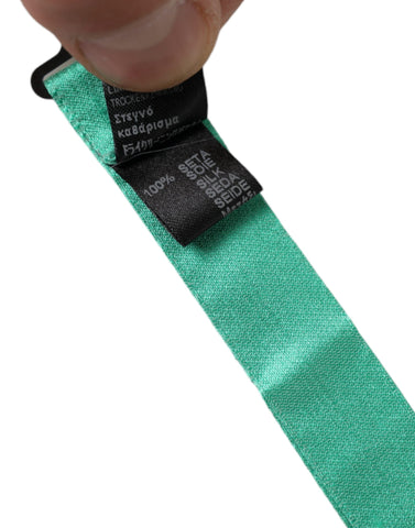 Mint green silk adjustable men's bow tie by Dolce & Gabbana, featuring a classic bow tie shape and elegant design.