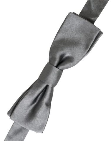 Gray satin silk adjustable men's bow tie with papillon style from Dolce & Gabbana, shown on a flat surface.