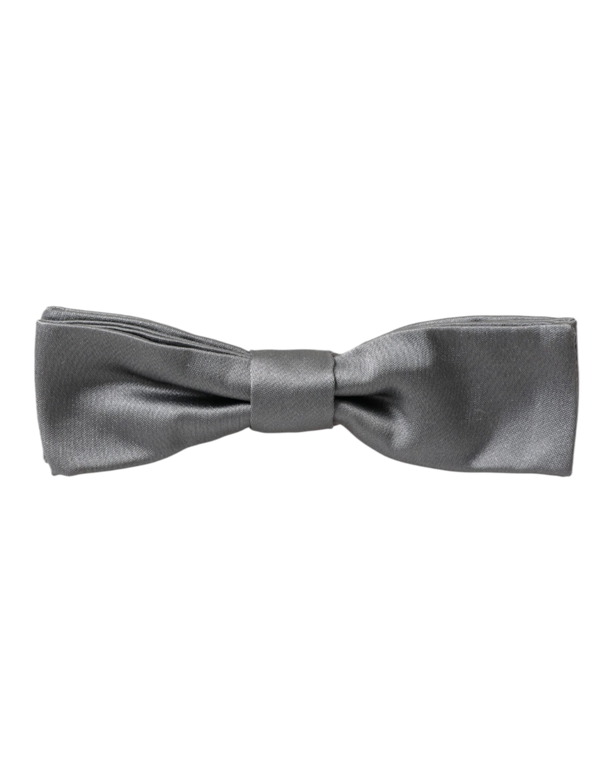 Gray satin silk adjustable men's bow tie with a papillon style, designed by Dolce & Gabbana, shown in the image.