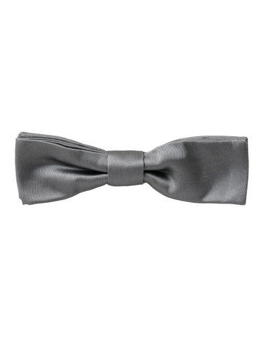 Gray satin silk adjustable men's bow tie with a papillon style, designed by Dolce & Gabbana, shown in the image.
