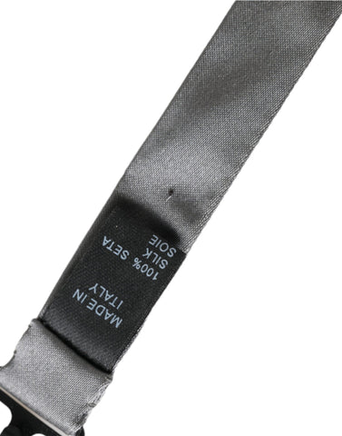Gray satin silk adjustable men's bow tie with butterfly shape, stylish and elegant, by Dolce & Gabbana.
