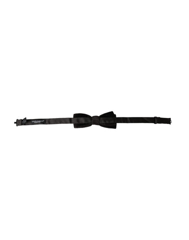 Black velvet cotton adjustable men's bow tie by Dolce & Gabbana, featuring a classic knot and smooth fabric finish.