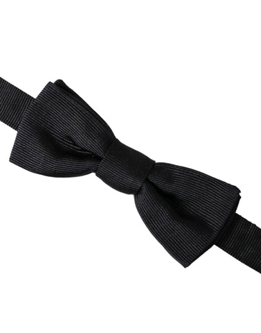 Black silk adjustable men's bow tie by Dolce & Gabbana, featuring a classic, elegant design for formal occasions.