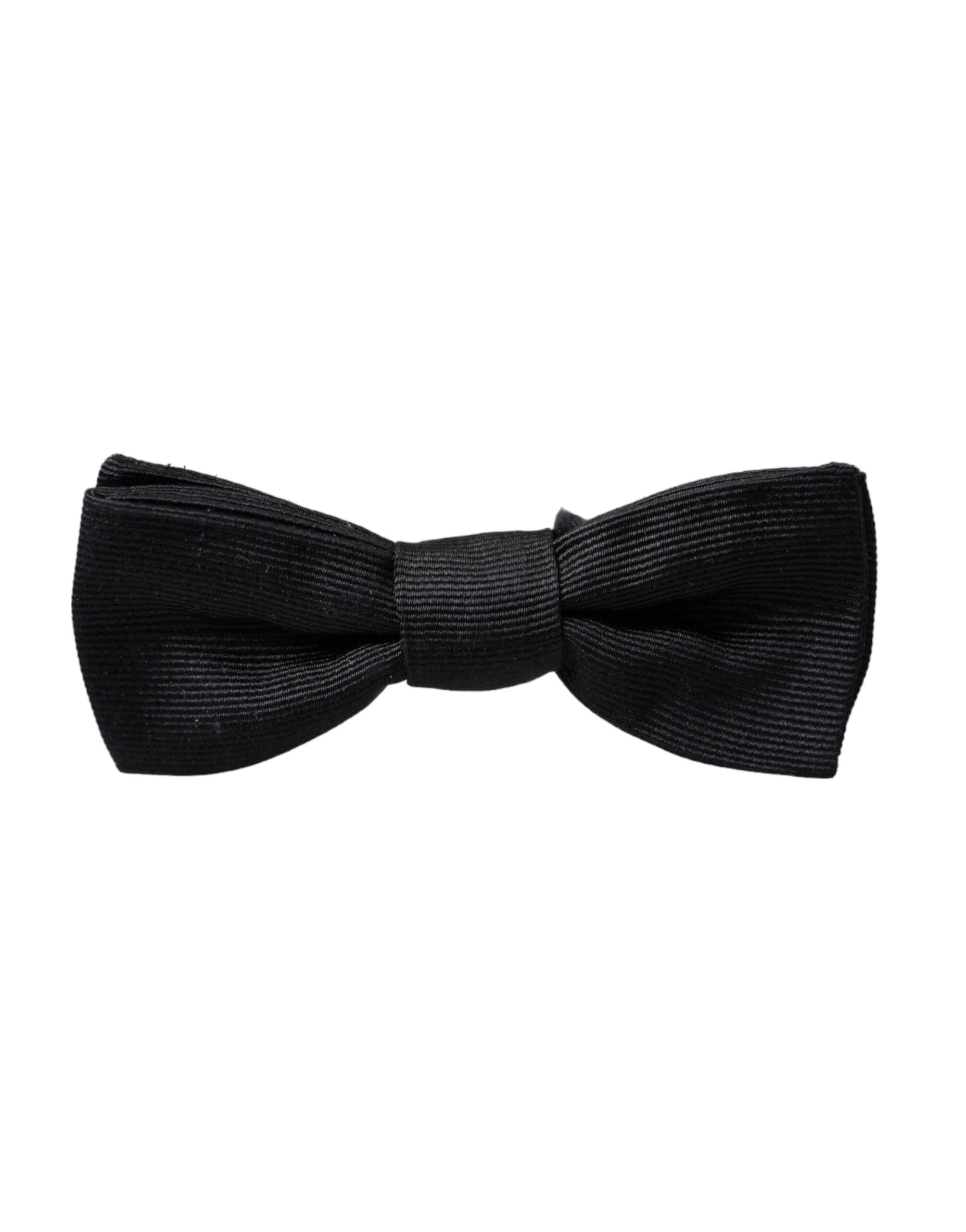 Black silk adjustable men's bow tie from Dolce & Gabbana, featuring a classic, elegant design for formal wear.