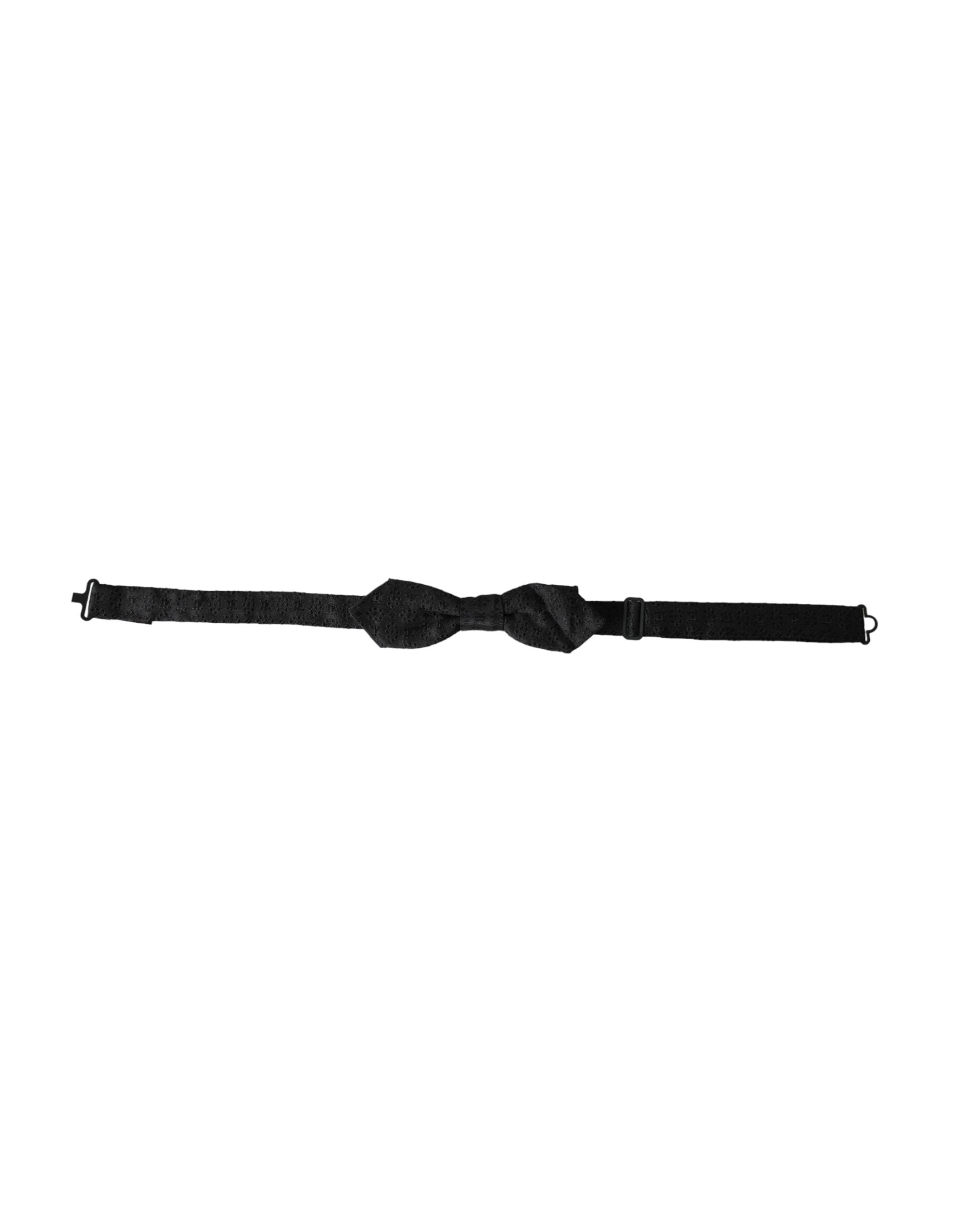 Black silk fantasy adjustable neck bow tie for men by Dolce & Gabbana, shown laid flat with detailed fabric texture.