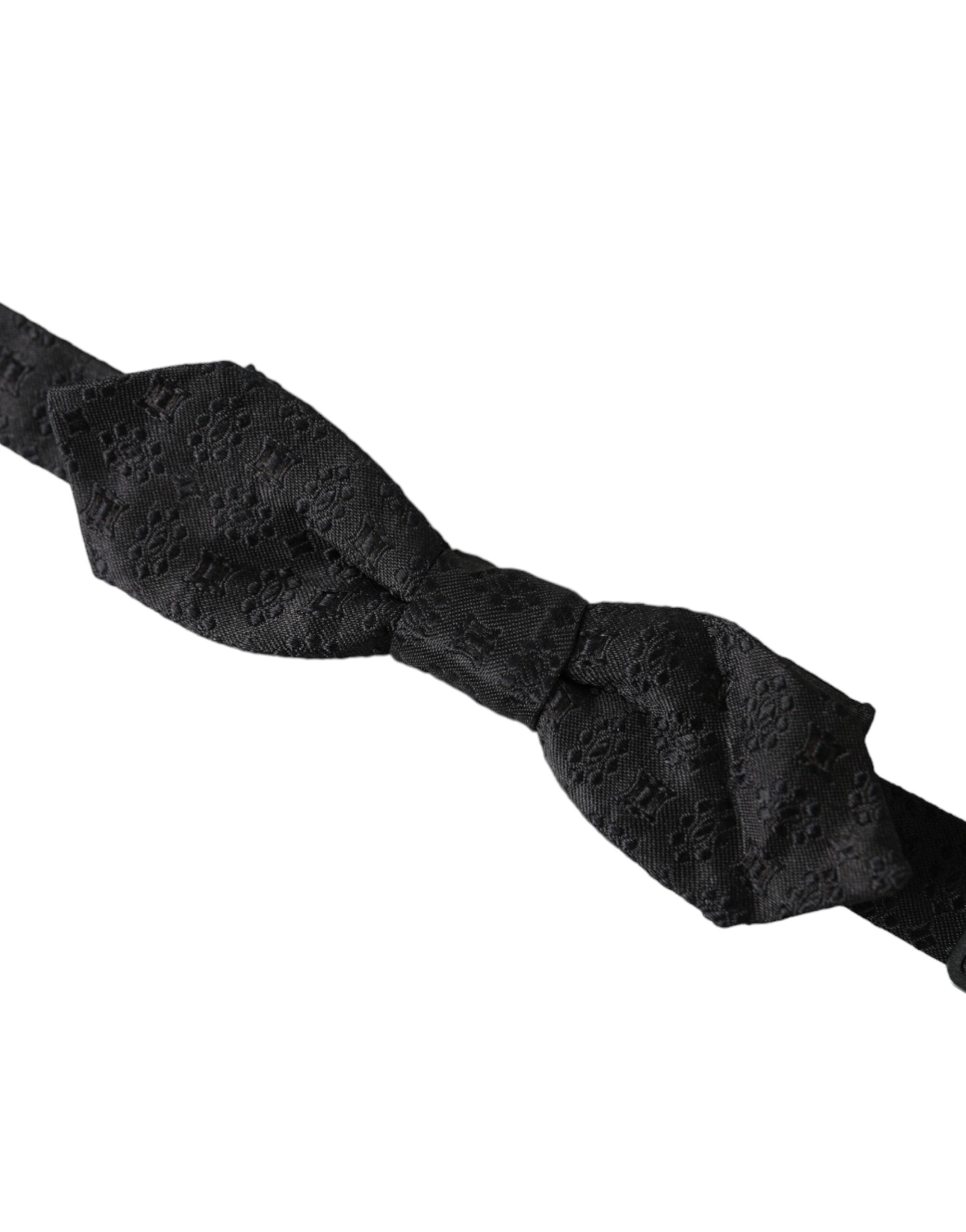 Black silk fantasy adjustable neck bow tie by Dolce & Gabbana, featuring a sleek and elegant design for men's formal wear.
