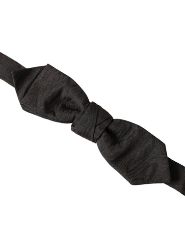 Black silk adjustable men's bow tie from Dolce & Gabbana, featuring a sleek, elegant design for formal wear.