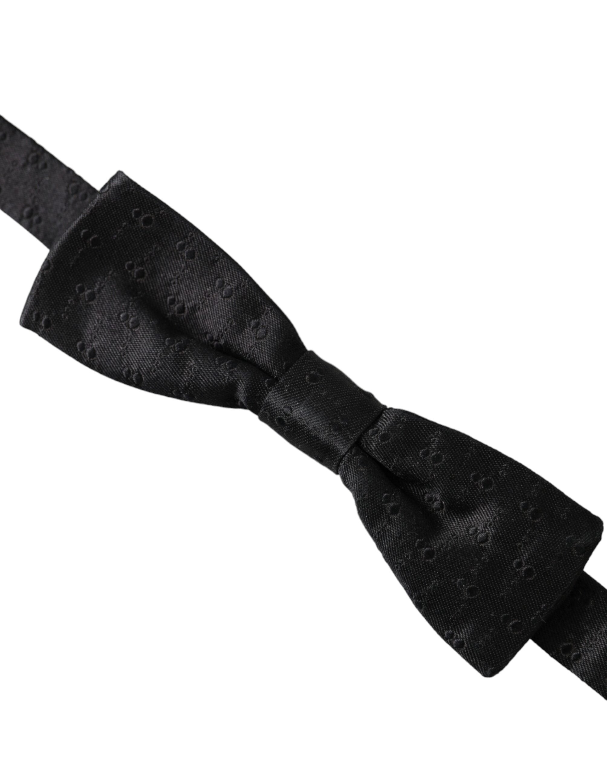Black silk patterned adjustable men's bow tie by Dolce & Gabbana, featuring a stylish design for formal wear.