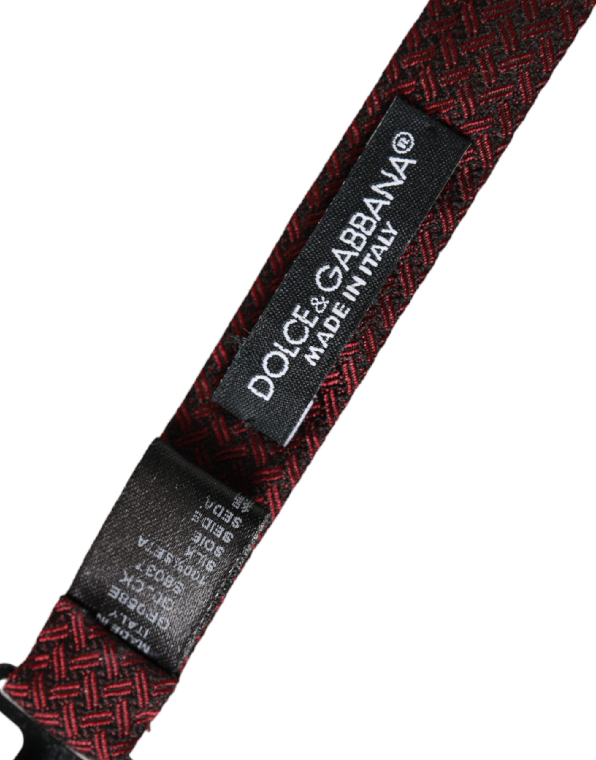 Red silk fantasy adjustable neck bow tie by Dolce & Gabbana, featuring intricate design and classic style for men's formal wear.