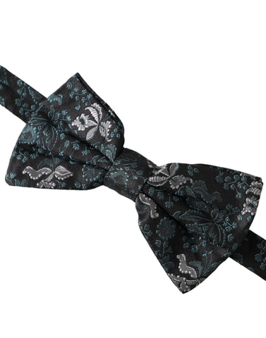 Multicolor fantasy floral silk bow tie with adjustable neck strap for men, by Dolce & Gabbana, featuring vibrant floral patterns.