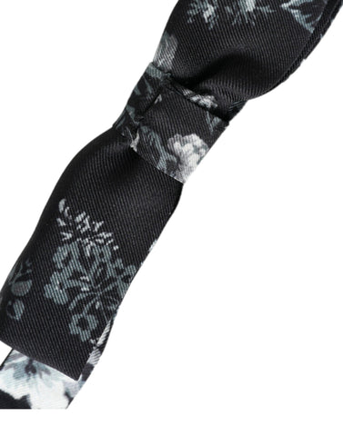 Black floral silk adjustable neck bow tie by Dolce & Gabbana, featuring a stylish floral pattern and classic shape.