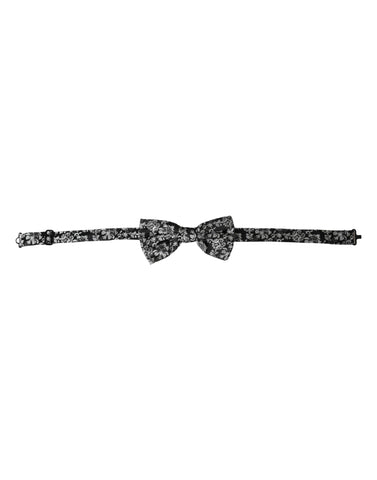 Black floral silk adjustable neck bow tie by Dolce & Gabbana, featuring a stylish floral pattern and elegant design.