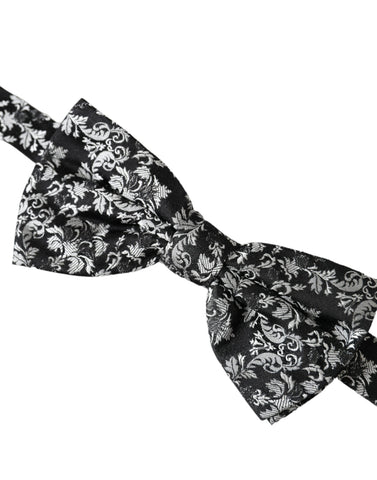Black floral silk adjustable neck bow tie by Dolce & Gabbana, featuring a stylish floral pattern and classic design.
