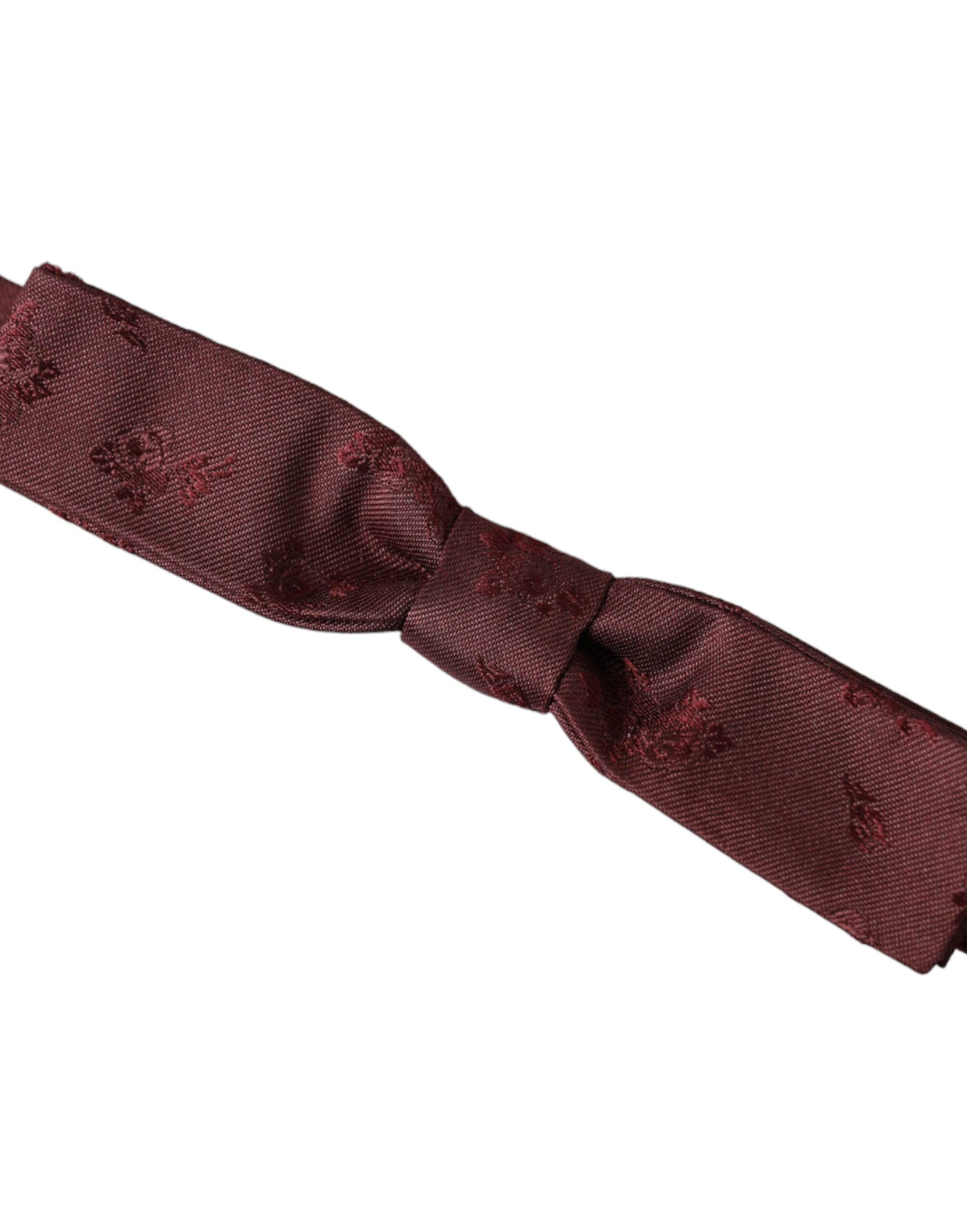 Maroon floral silk adjustable neck bow tie by Dolce & Gabbana, featuring a stylish floral pattern and elegant silk fabric.