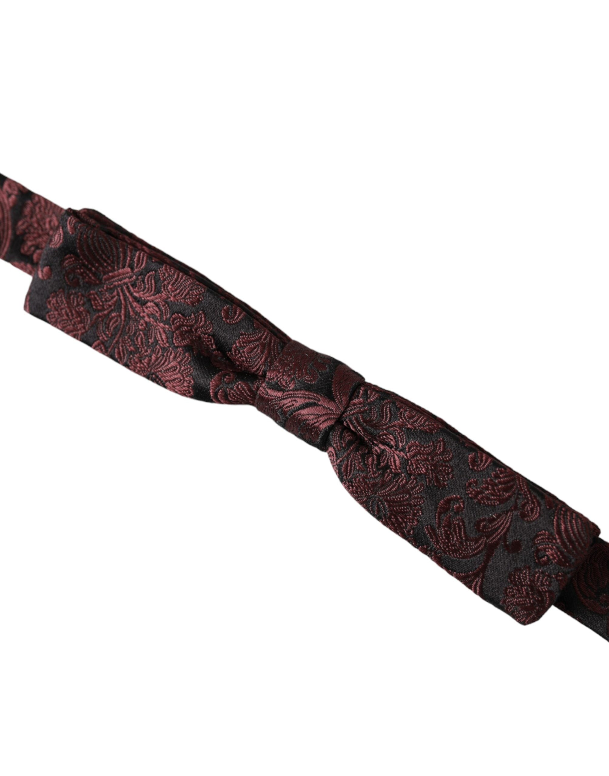 Maroon floral silk adjustable men's bow tie by Dolce & Gabbana, featuring a stylish floral pattern and classic bow shape.