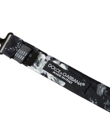 Black floral fantasy adjustable neck bow tie by Dolce & Gabbana, featuring a stylish floral pattern and classic bow shape.