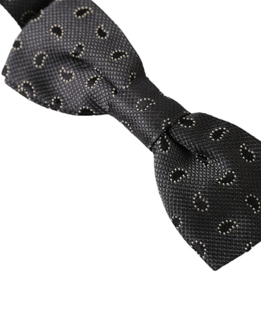 Black silk patterned adjustable men's bow tie by Dolce & Gabbana, showcasing elegant design and classic style.