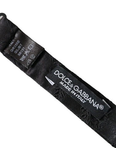 Multicolor fantasy silk adjustable neck bow tie by Dolce & Gabbana displayed on a white background.