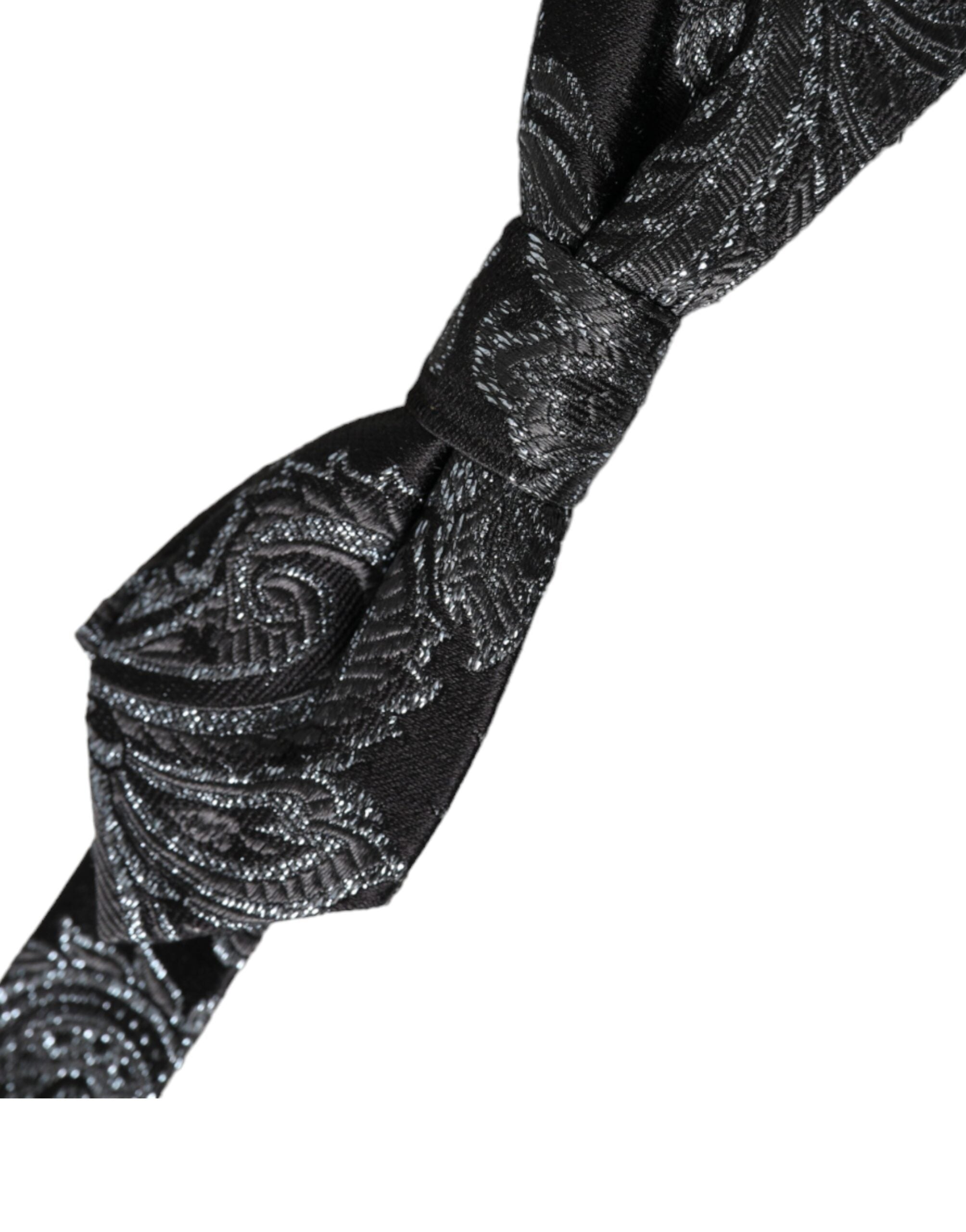 Black silk jacquard adjustable men's bow tie by Dolce & Gabbana, featuring intricate pattern and classic style.