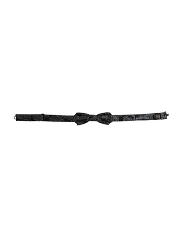Black silk jacquard adjustable men's bow tie by Dolce & Gabbana, shown with a classic bow shape and intricate pattern.