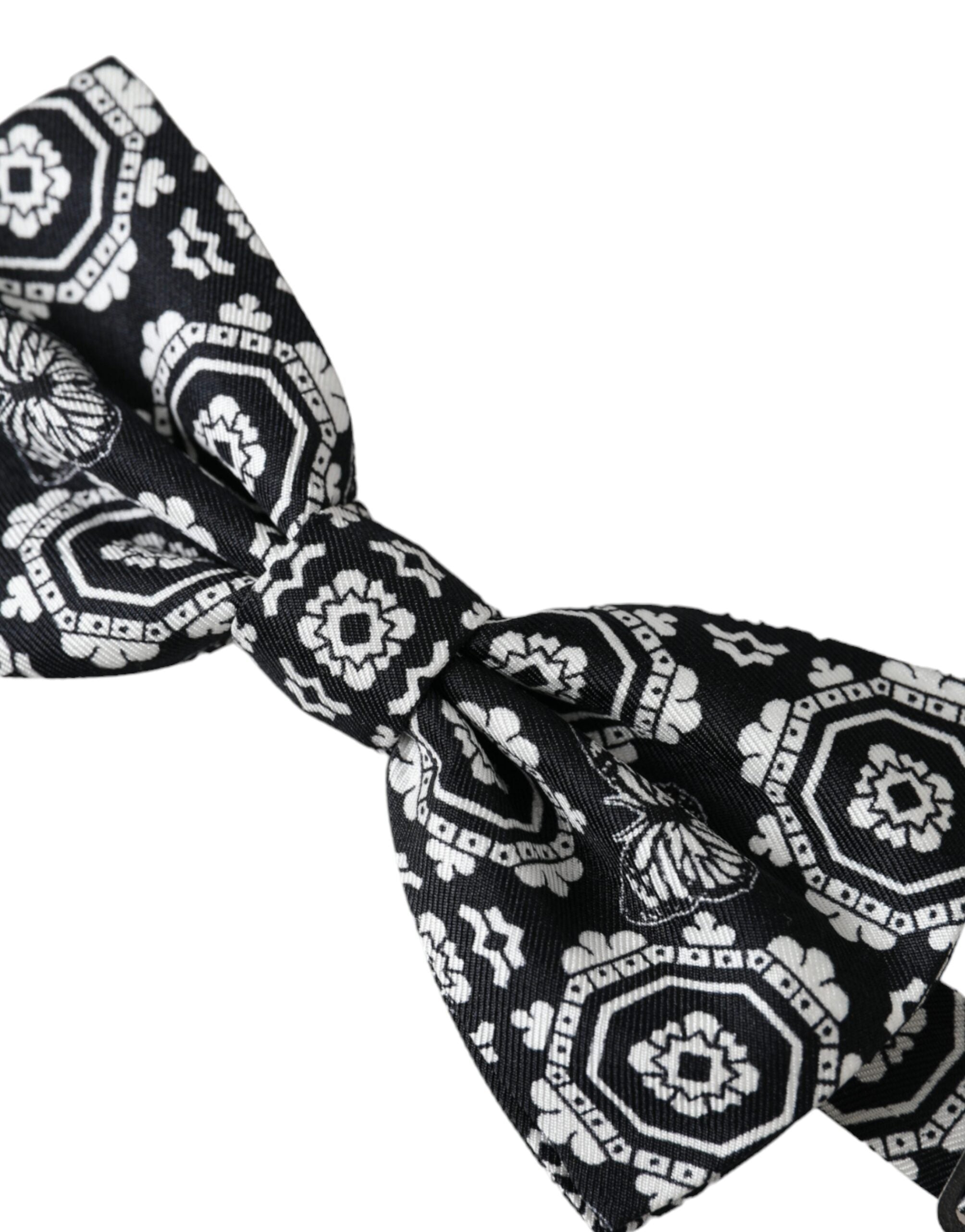 Black and white printed adjustable neck bow tie for men by Dolce & Gabbana, featuring a stylish designer pattern and classic fit.