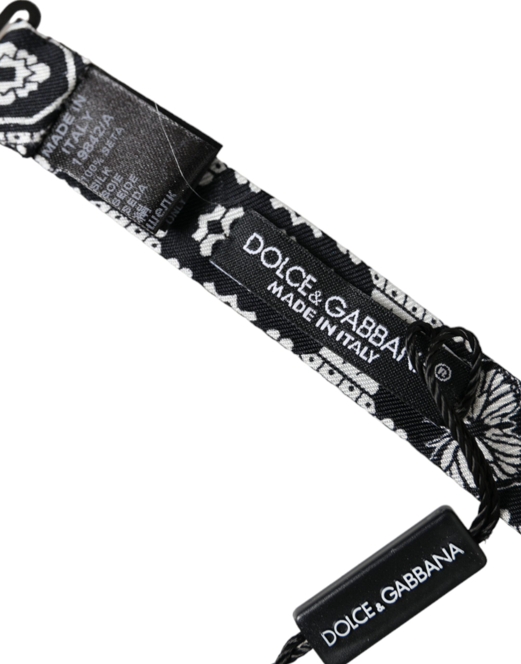 Black and white printed adjustable men's bow tie by Dolce & Gabbana, featuring a stylish pattern and classic design.