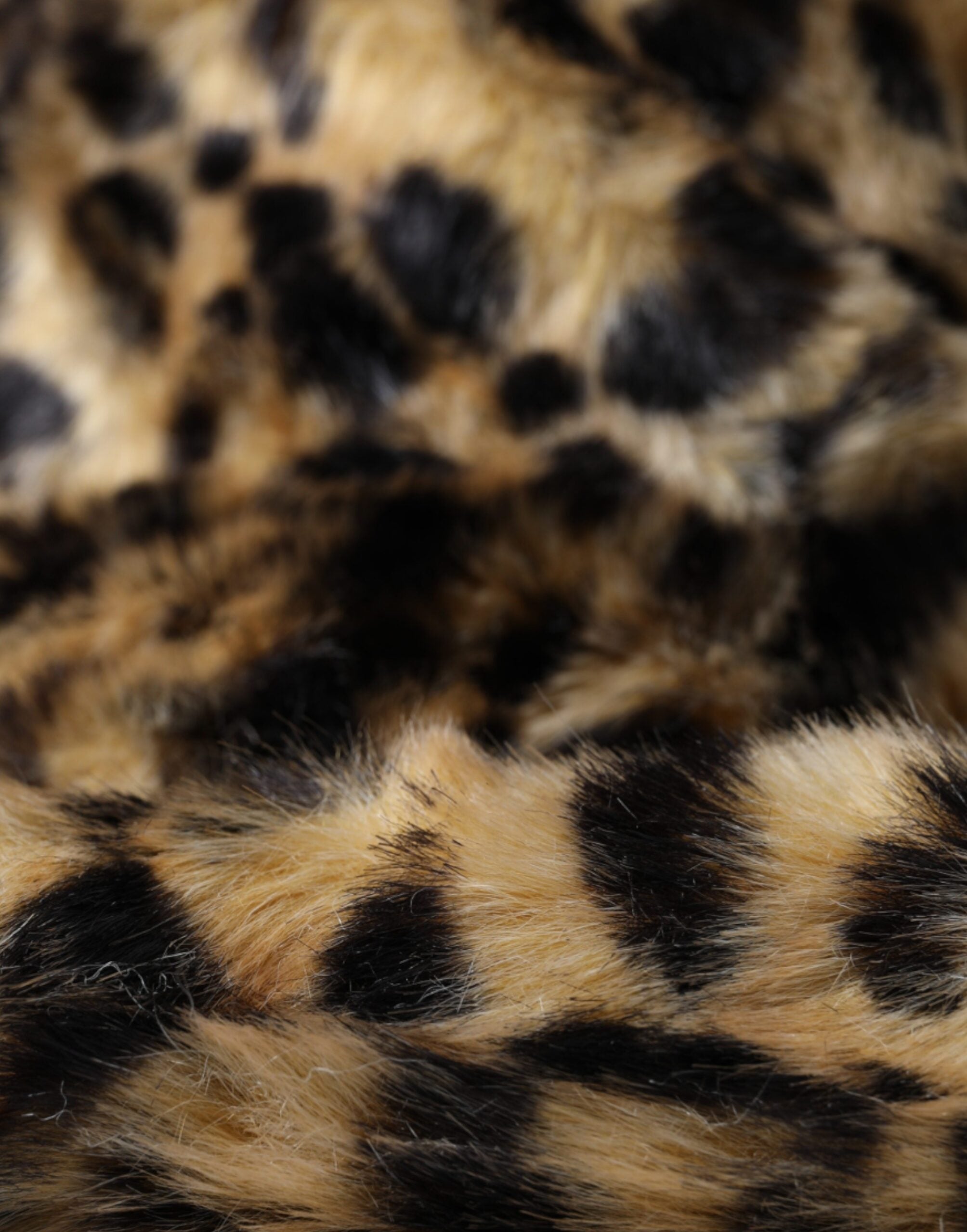 Brown leopard fur bucket hat for women by Dolce & Gabbana, featuring soft fur and stylish leopard print design.
