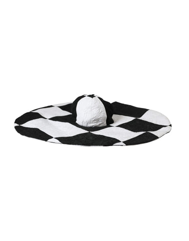Black and white checkered wide brim floppy hat by Dolce & Gabbana, featuring a stylish, oversized sun hat design with a flexible brim.