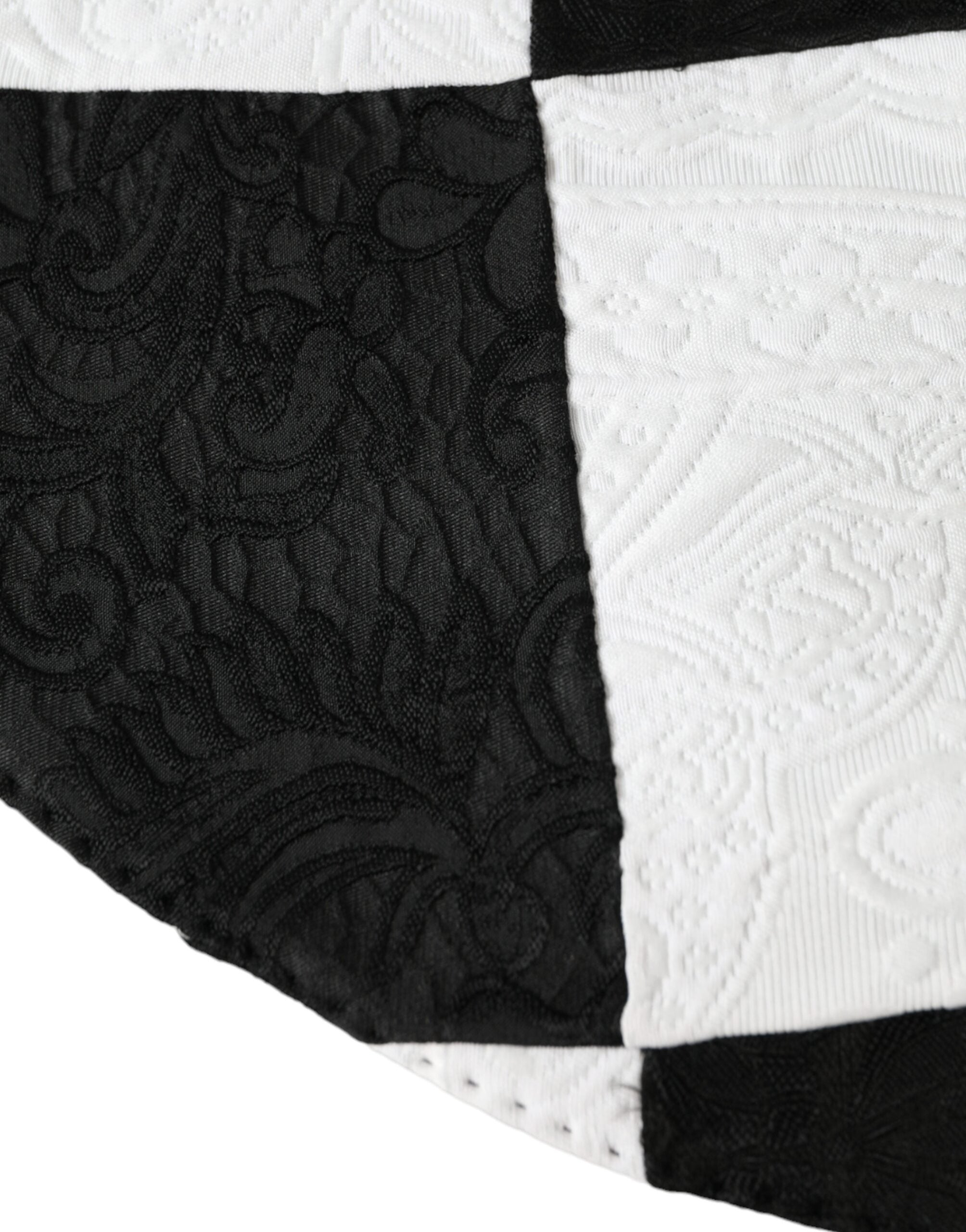 Black and white checkered wide brim floppy hat by Dolce & Gabbana, featuring a stylish, oversized design with a soft fabric texture.