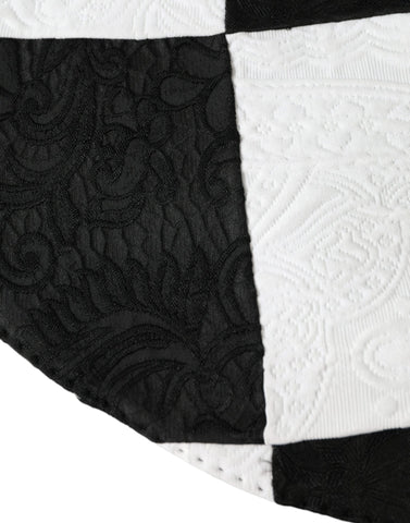 Black and white checkered wide brim floppy hat by Dolce & Gabbana, featuring a stylish, oversized design with a soft fabric texture.
