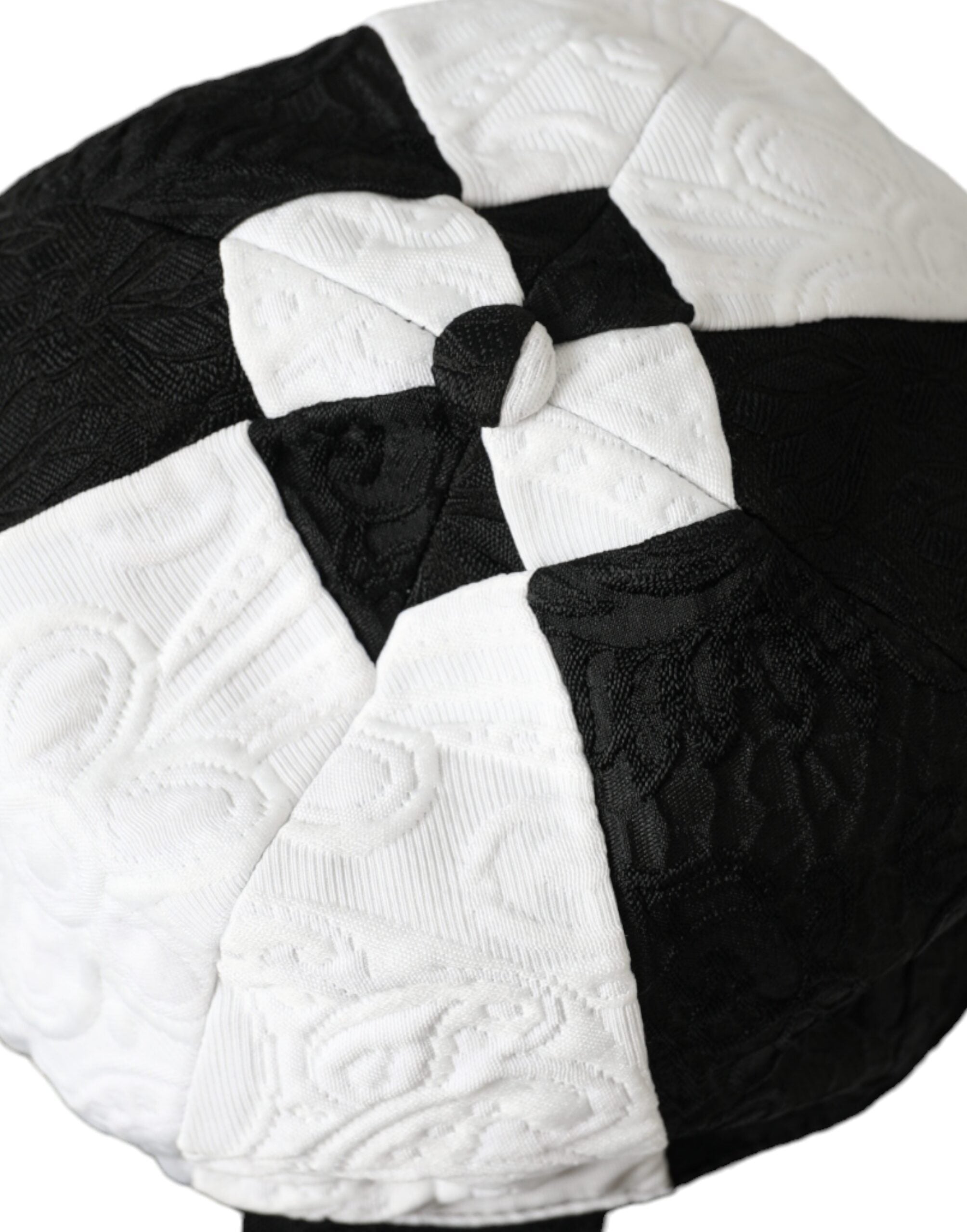 Black and white checkered wide brim floppy hat by Dolce & Gabbana, featuring a stylish, oversized design perfect for sun protection and fashion.