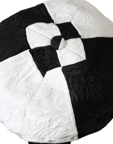 Black and white checkered wide brim floppy hat by Dolce & Gabbana, featuring a stylish, oversized design perfect for sun protection and fashion.